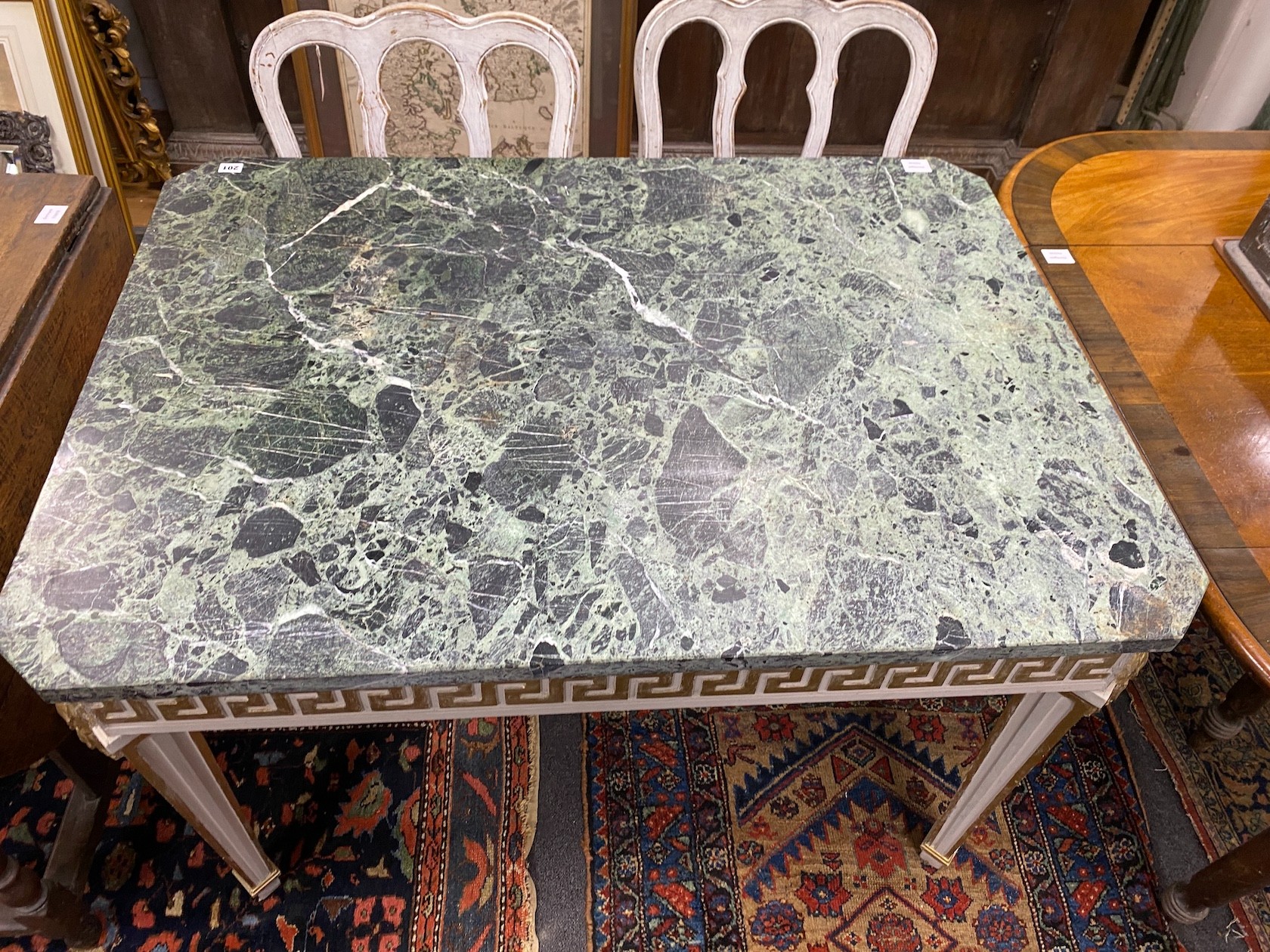 A William Kent style cream and gilt painted side table, with a green variegated marble top, width 118cm, depth 85cm, height 77cm